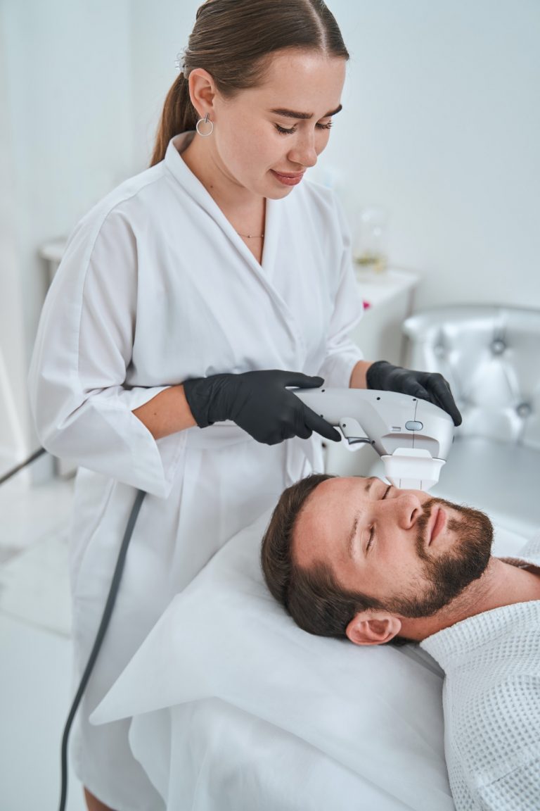 Beauty doctor carrying out a non-invasive skin tightening procedure